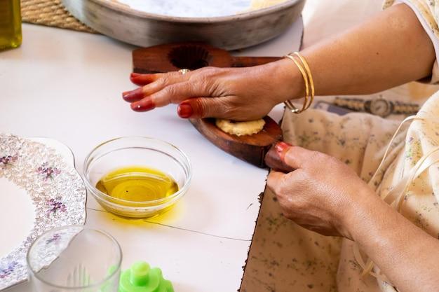 Woman applying natural oil on hands for skincare